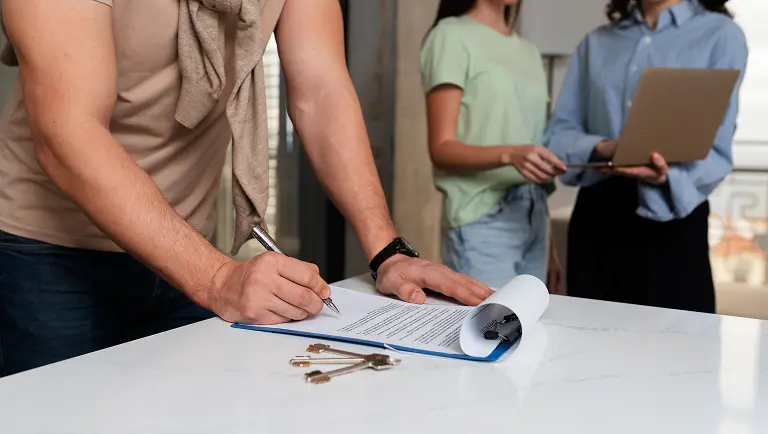 side-view-buyer-signing-document